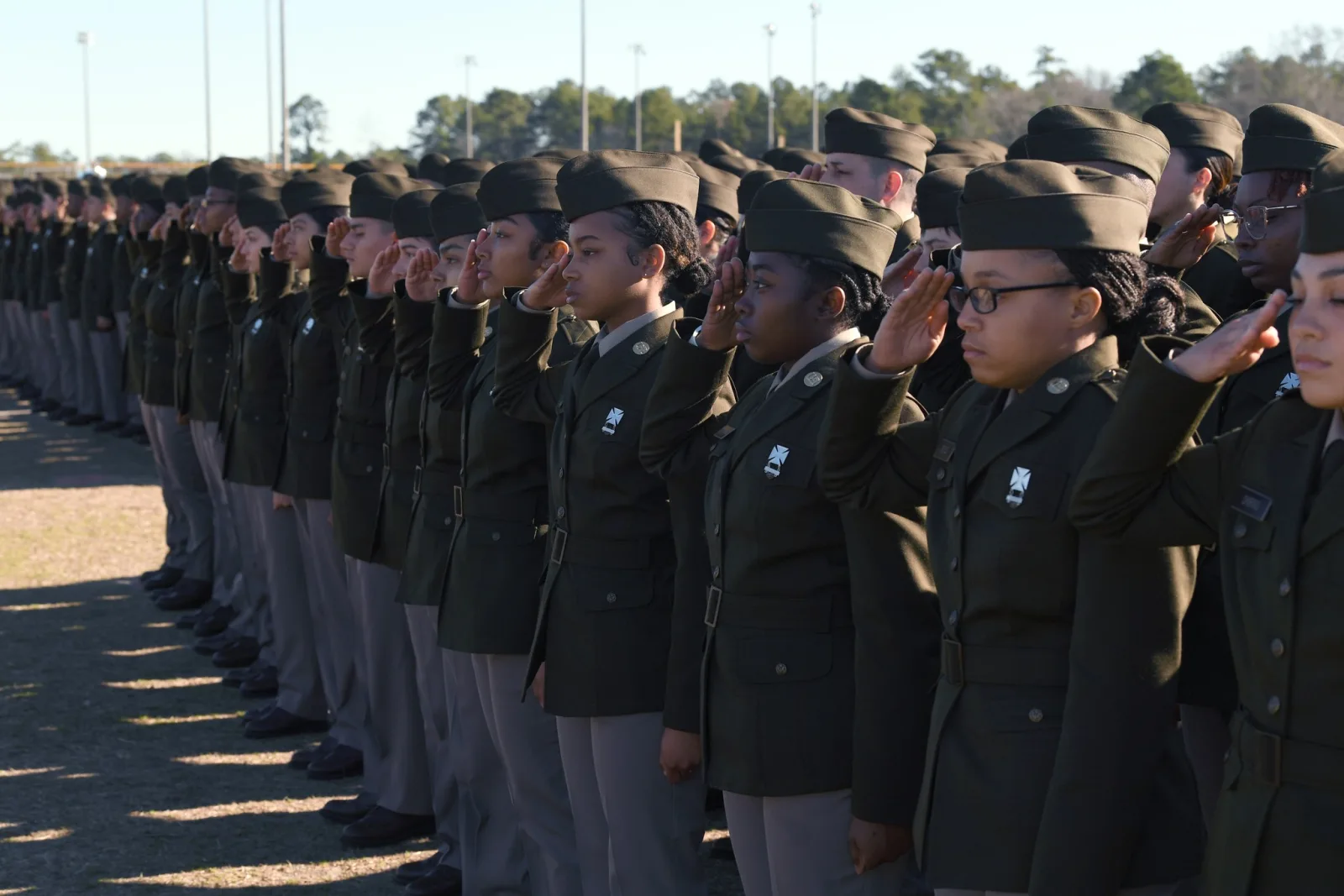 Soldiers from 1st Battalion, 13th Infantry Regiment salute during their Basic Combat Training graduation at Hilton Field, Fort Jackson, February 2024. U.S. Army photo via DVIDS.